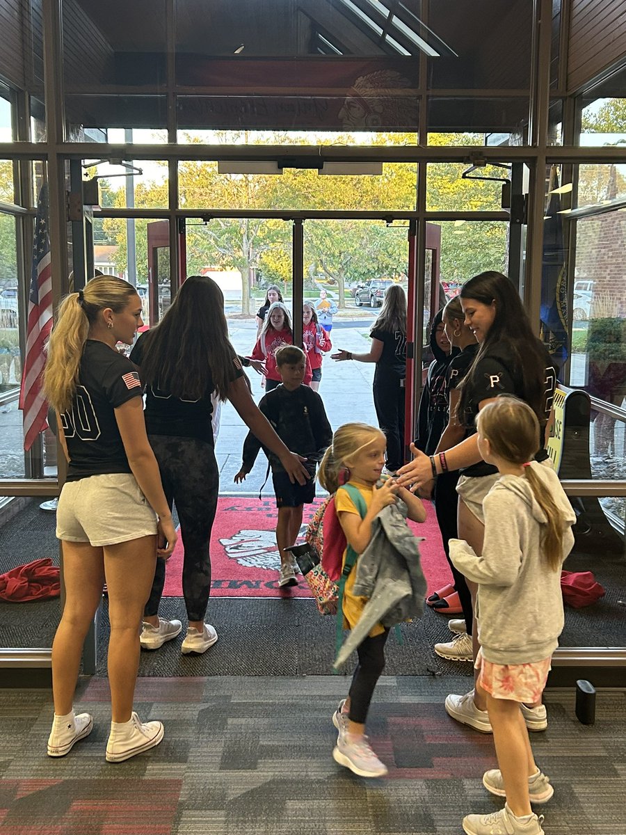 Softball girls greeting elementary students this morning. Come out and support the Patriots tonight!