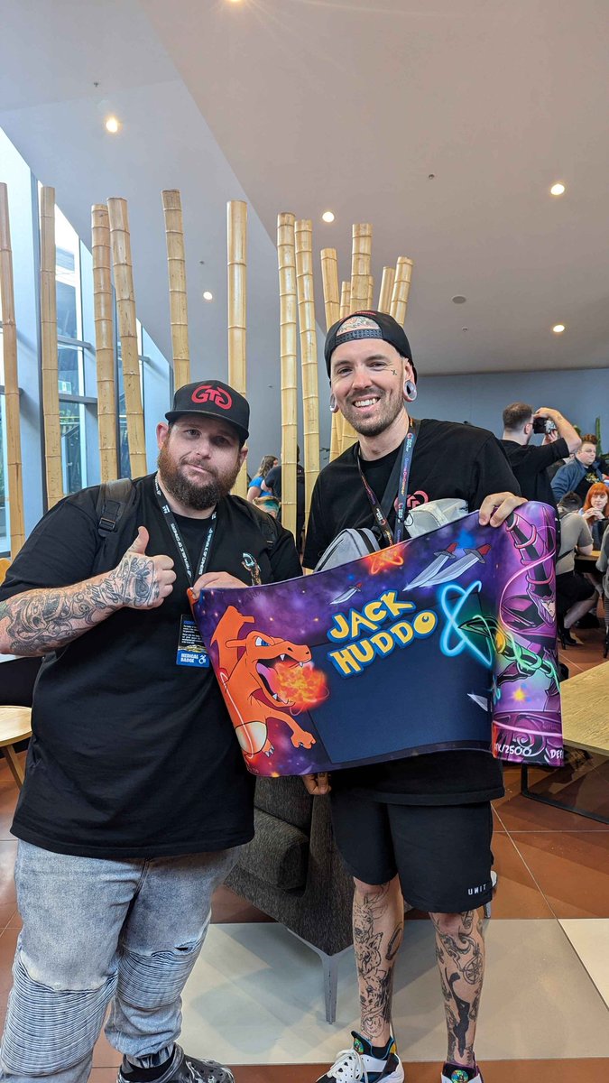 _beastmodemat's tweet photo. Finally got to hand over the custom mouse pad/tcg mat that I spent 40+ hours working on that @quokkapads very generously printed out and sent to me to present to @JackHuddo  at @PAXAus! It's a charizard VS  dark magician battle scene and it turned out amazing!! 😍😊 https://t.co/MHgd4YxA1G