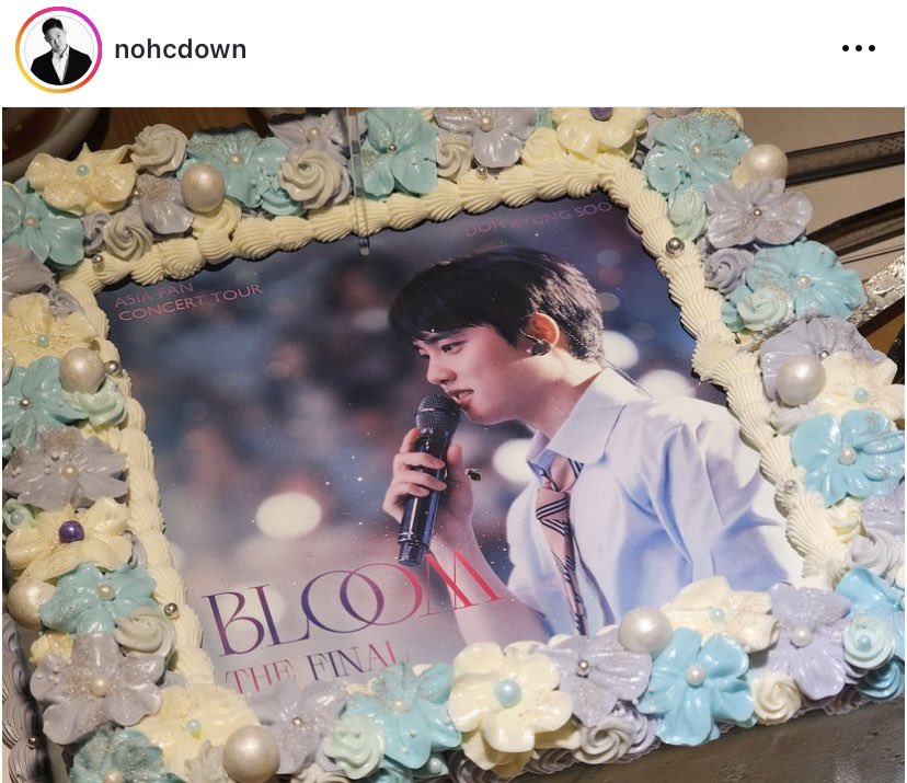 Kyungsoo’s cake is so cute and pretty. It’s also surrounded by flowers. 😂🩵🤍