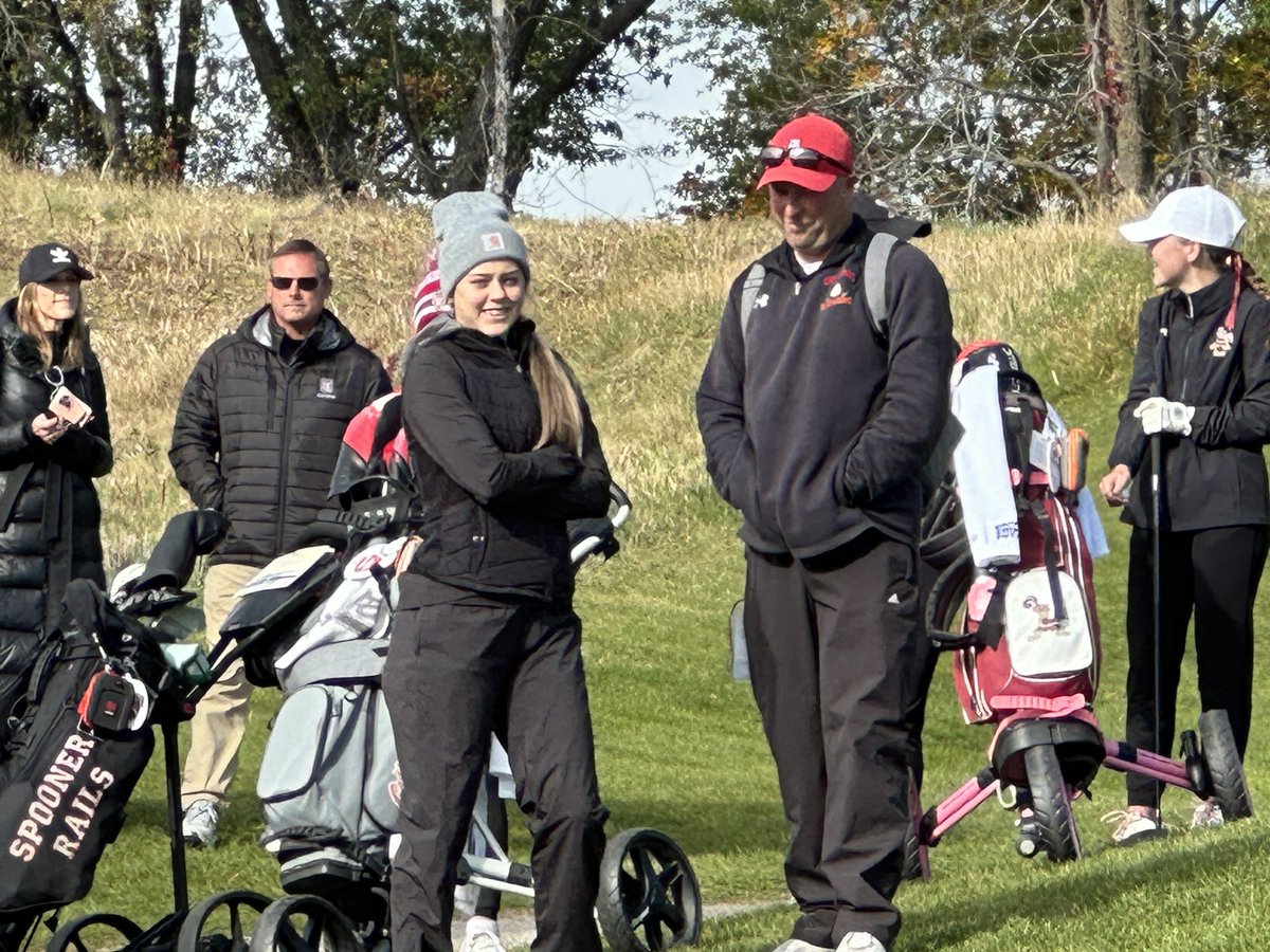 The pride of Elk Mound, left, defending D2 state champ Belle Kongshaug and the pride of Colfax, her coach Ryan Krall. Together, they are the Colfax/Elk Mound co-op. She is the last golfer off the 1st tee on Day 1 of #WIHSGolf state girls golf. <a href="/wiaawistate/">WIAA State Tournaments</a> <a href="/WSGAGolf/">WSGA Golf</a> <a href="/Wisdotgolf/">Wisconsin.Golf</a>
