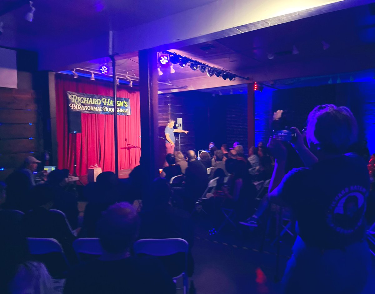 SusanLambert's tweet photo. @PodcastMovement Yes and yes! Love @AstonshngLegnds live shows. I can also highly recommend @RichardHatem and his Paranormal Bookshelf. His first live show was Thursday - sold out! Super unique venue, wonderful crowd, cool special guests — amazing show. 
Excited to see more live podcasts. https://t.co/4Oa2ThJWer