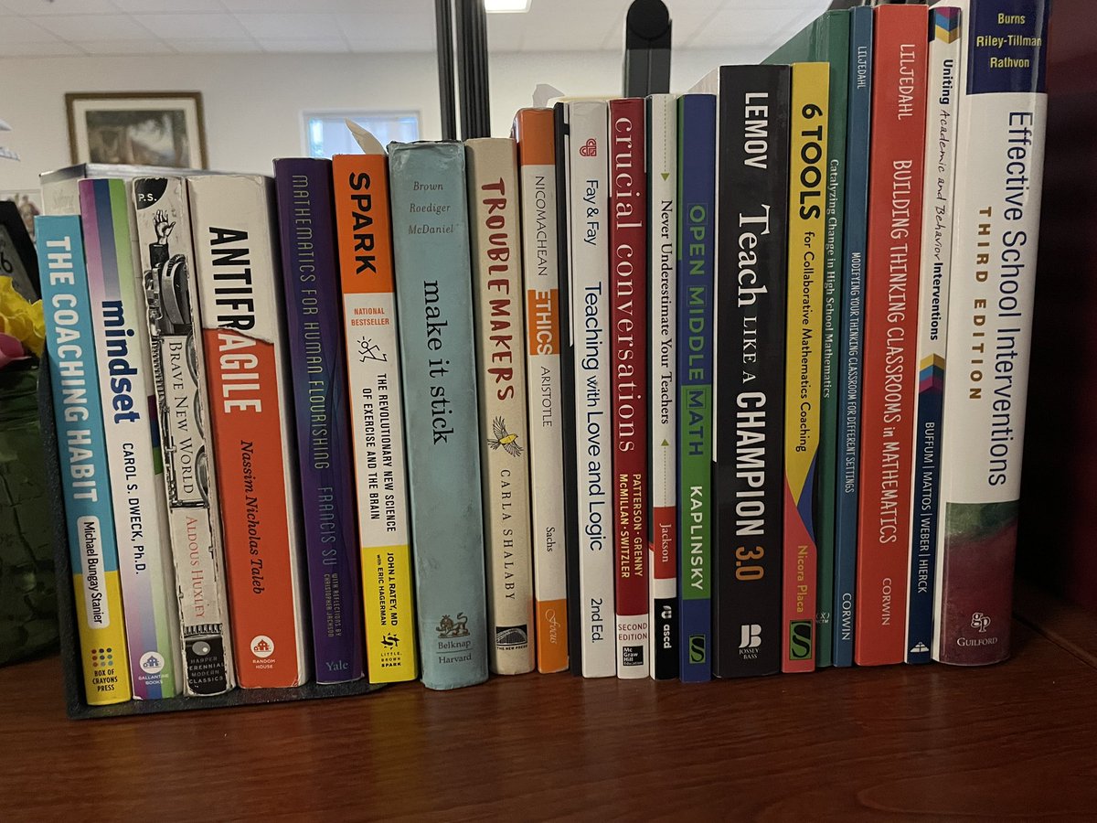 Classroom bookshelf and books on my desk. Not pictured: <a href="/Mathgarden/">Sunil Singh</a> because his books are on my kindle