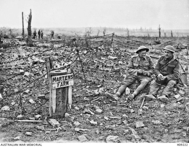 ww1cemeteries's tweet photo. Wytschaete, Belgium. c. 1917. Two British Army soldiers seated beside a sign which indicates that the devastated area had been known as Martens Farm. https://t.co/hSY875jiKI