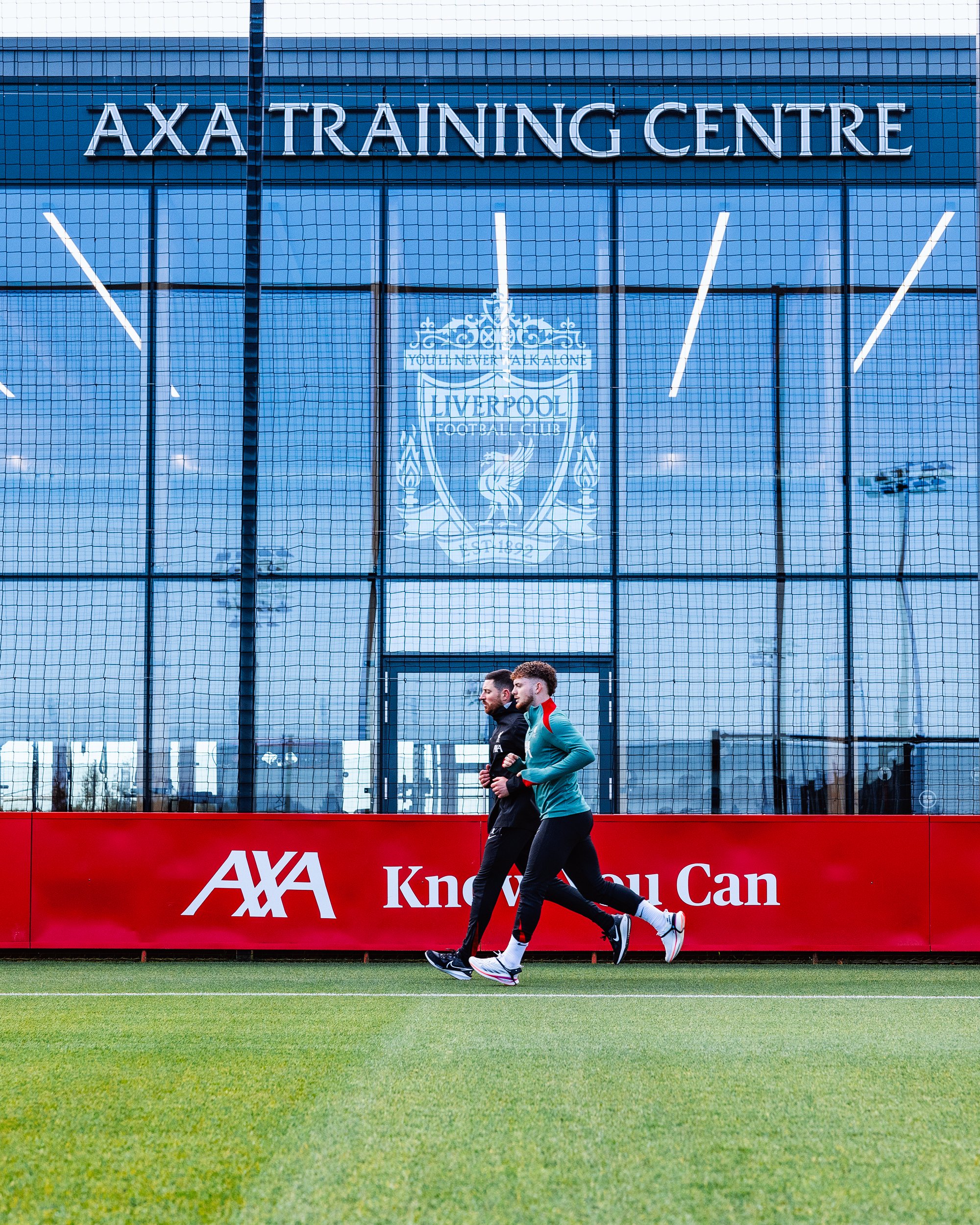 Harvey Elliott running out on the training pitch at the AXA Training Centre