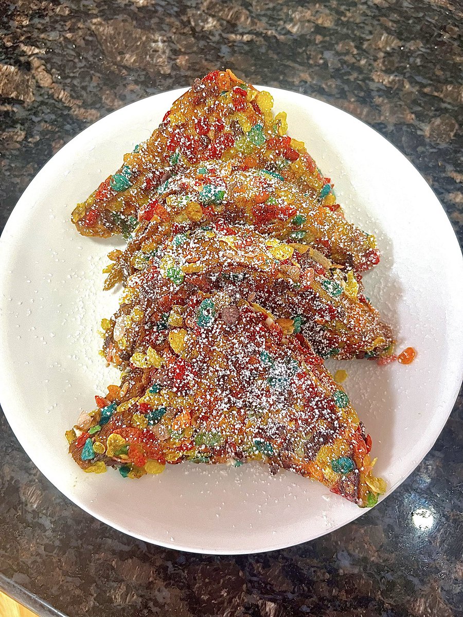 TrademarkRaza's tweet photo. fruity pebble crusted sweet cream cheese stuffed french toast https://t.co/rEvPpUTXdI