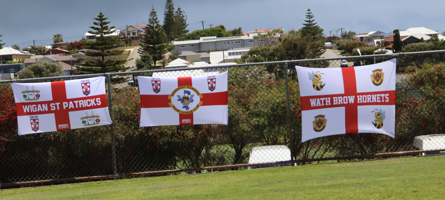 The guys visited the venue of our games this morning. We carry a little piece of England with us in the form of flags with team name and  badges of the different sides represented through this Open Age side and these will be near the team every time they train or play. 1/2