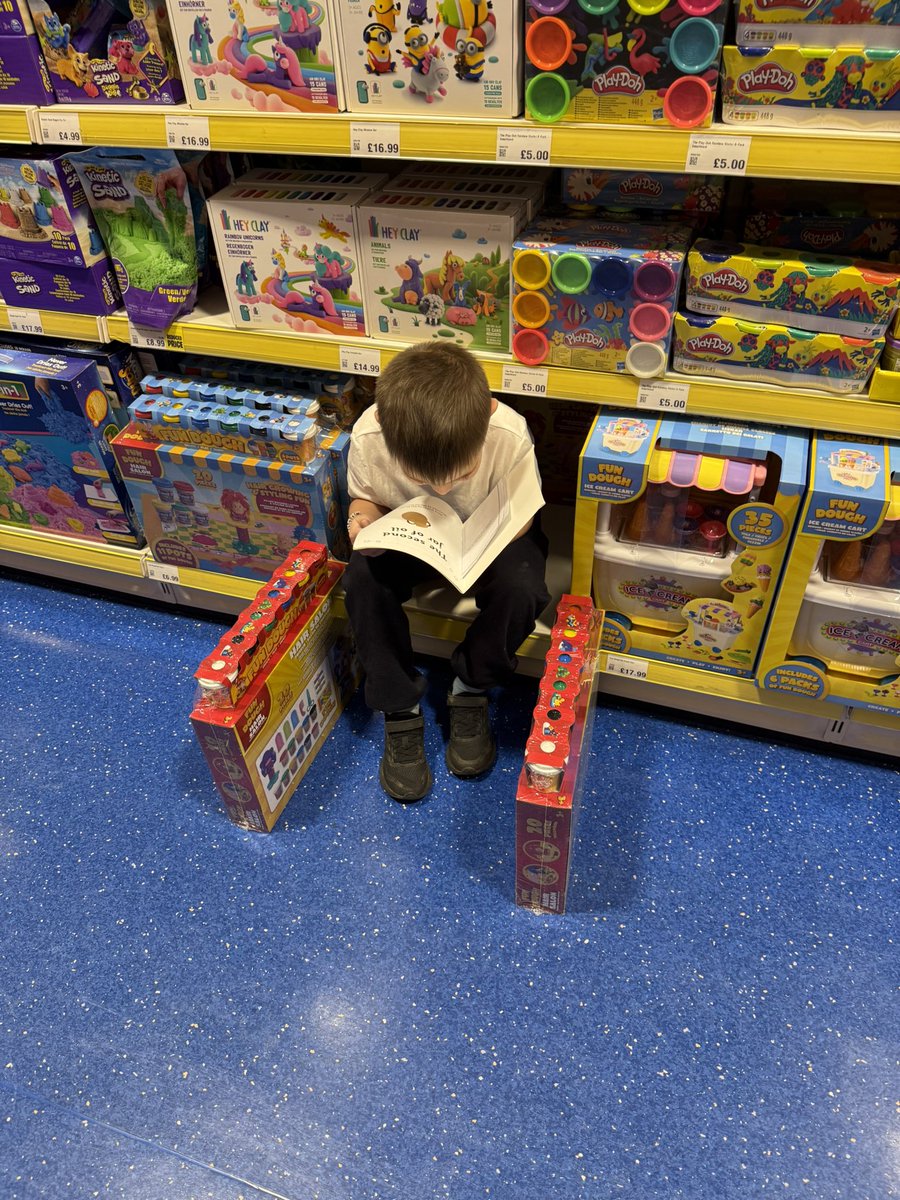 A trip to smyths and he’s reading his book! X