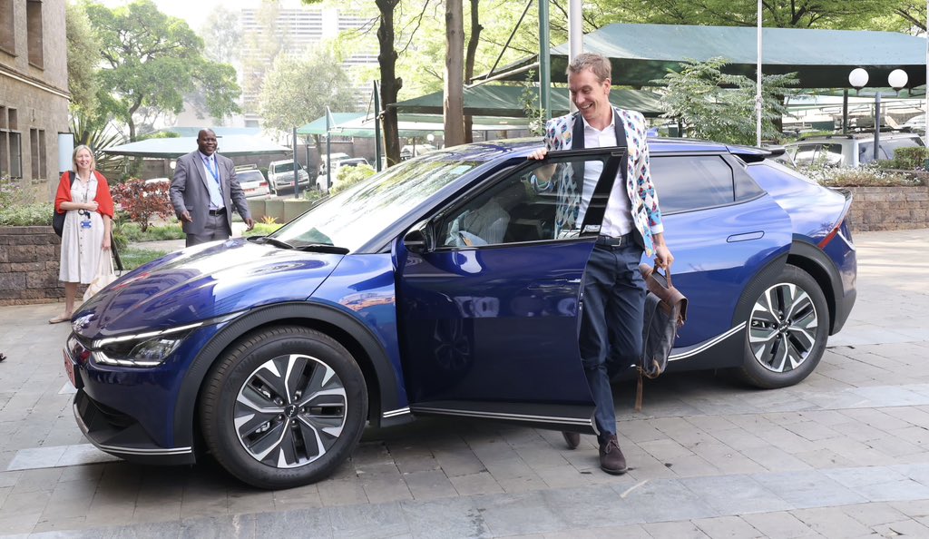 Here’s the <a href="/UKinKenya/">UK in Kenya 🇬🇧🇰🇪</a> leading by example on a green transition as we launched our first EV this morning. 

A smooth, silent and clean drive into the office.

Can you make out the “E” and the “V” in the hand signals in the photo with our awesome Green Committee?