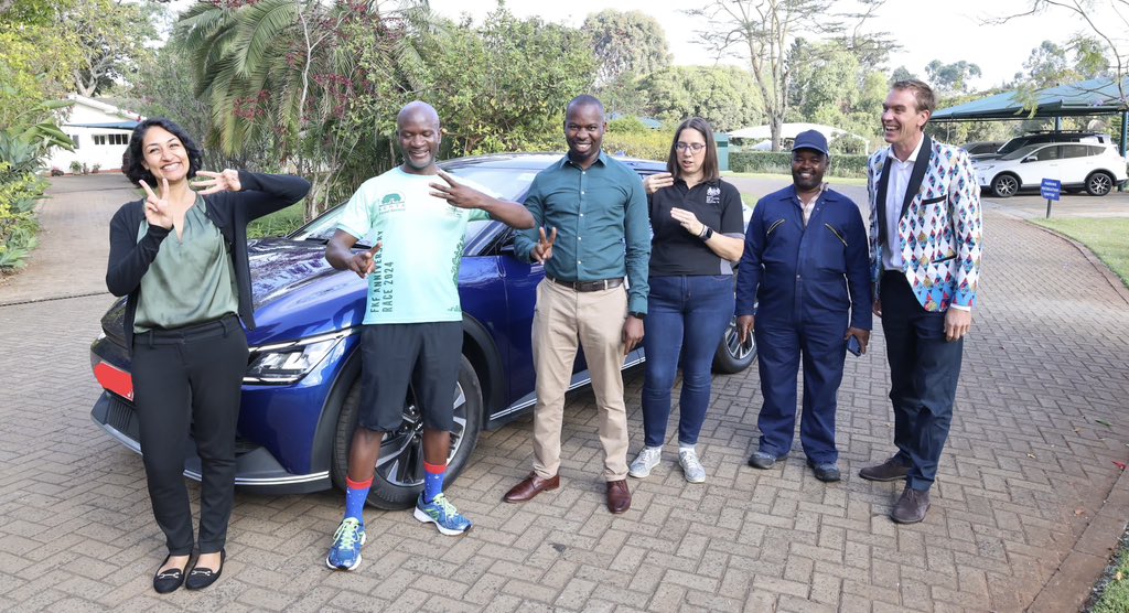 edwardabarnett's tweet photo. Here’s the @UKinKenya leading by example on a green transition as we launched our first EV this morning. 

A smooth, silent and clean drive into the office.

Can you make out the “E” and the “V” in the hand signals in the photo with our awesome Green Committee? https://t.co/D8U2Ds1uzi