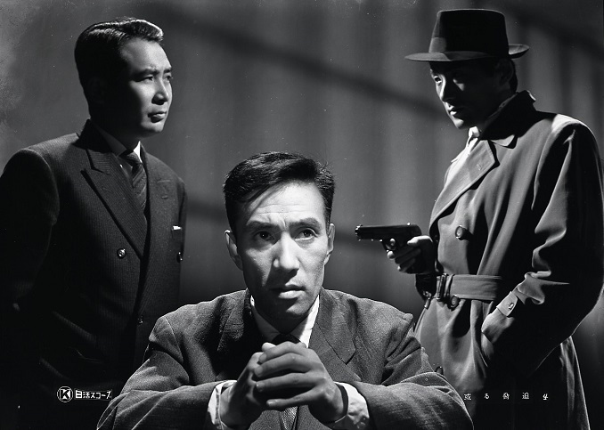 『ある脅迫』（６０・蔵原惟繕）は列車で始まり列車で終わる日活SPの佳作。幼馴染で出世した金子信雄と万年平社員の西村晃。本店銀行に業務部長として転勤が決まり得意絶頂の金子だったが好事魔多し、負け犬と侮っていた西村の反撃が物語に鞭を入れる。金子と西村のヒリヒリするような心理戦がいい。