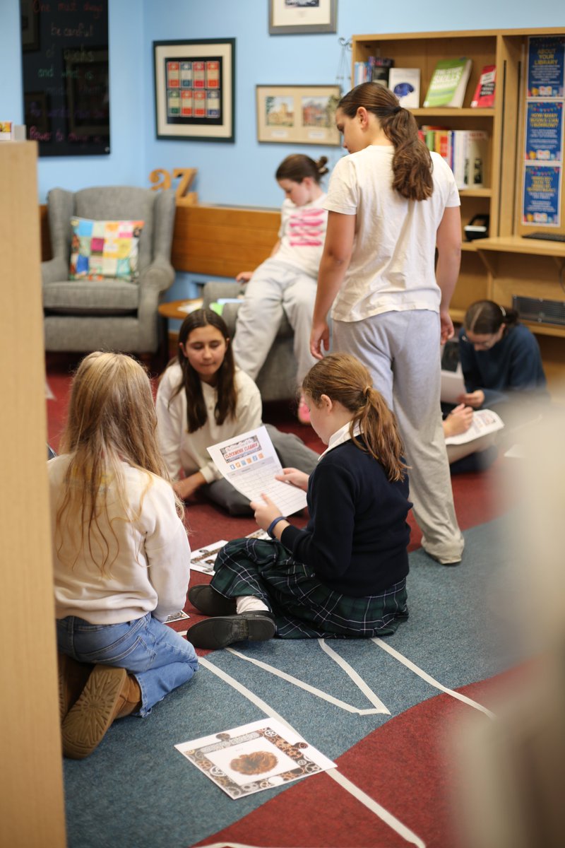 The library was buzzing with excitement on Friday evening as the Fourth Form took part in a captivating Murder Mystery event. Pupils eagerly read through the suspects' statements and collaborated with the 'crime scene manager' expertly portrayed by Library Prefect Rose S (U6)