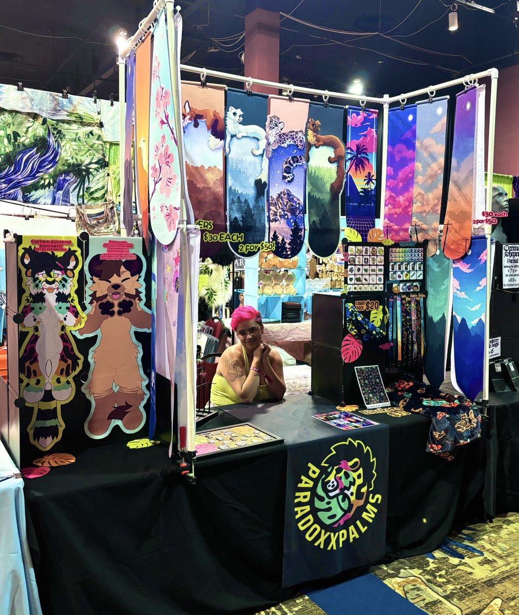 paradoxxpalms's tweet photo. I'm at BLFC!!! Come say hi! I am debuting a bunch of brand new banners and a few new lanyards 🩷🫶
(ft my beautiful wife in these photos) https://t.co/OqDGiLp1Kb