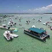 's tweet image. I never noticed any flags while boating during my youth in Florida. Disturbing how symbols of hate have surfaced in places that once felt carefree and inclusive #UnityOverHate #ThisIsNotUs 

#