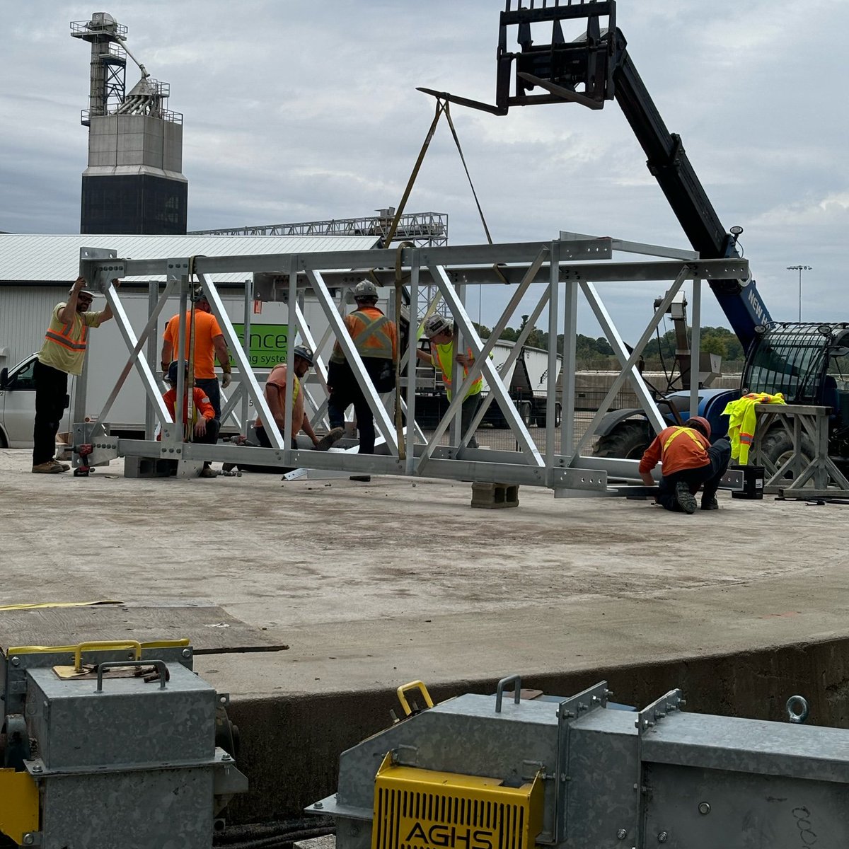 All hands on deck at AGHS, assembling catwalks for bin conveyors, hopefully before the rain arrives!