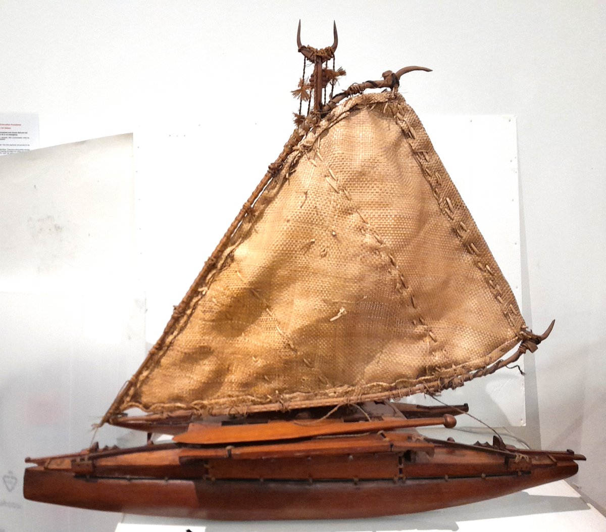 ConservationBob's tweet image. Ipswich Museum conservation. A volunteer has been cleaning a Fijian model outrigger canoe presented in 1925. The model is made of wood with vegetable fibre sail and cabin, wooden oars and bailers. Cleaned with a vacuum, a smoke sponge and swabs. Treated with microcrystalline wax.