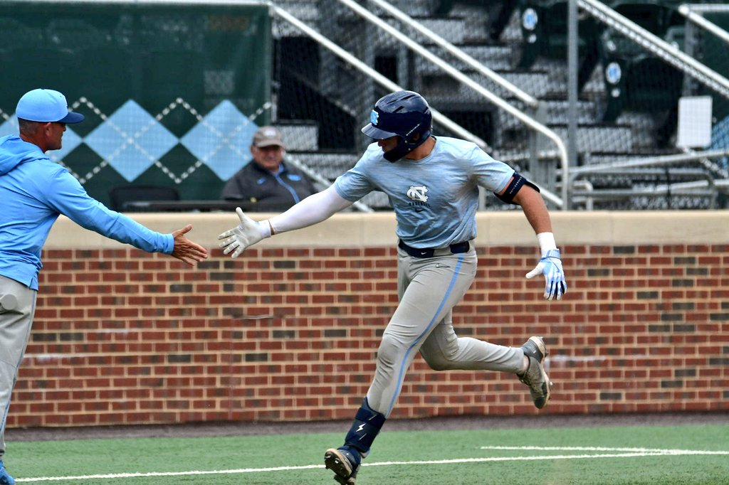Today I'm at Game 1 of the <a href="/DiamondHeels/">Carolina Baseball</a> fall world series. Catcher Macaddin Dye, who came to UNC from Liberty (along with coach Scott Jackson, pictured with Dye below), showed serious pop with a 2-run missile HR to left, 110 off the bat. Big upside; could DH and spell Stevenson.