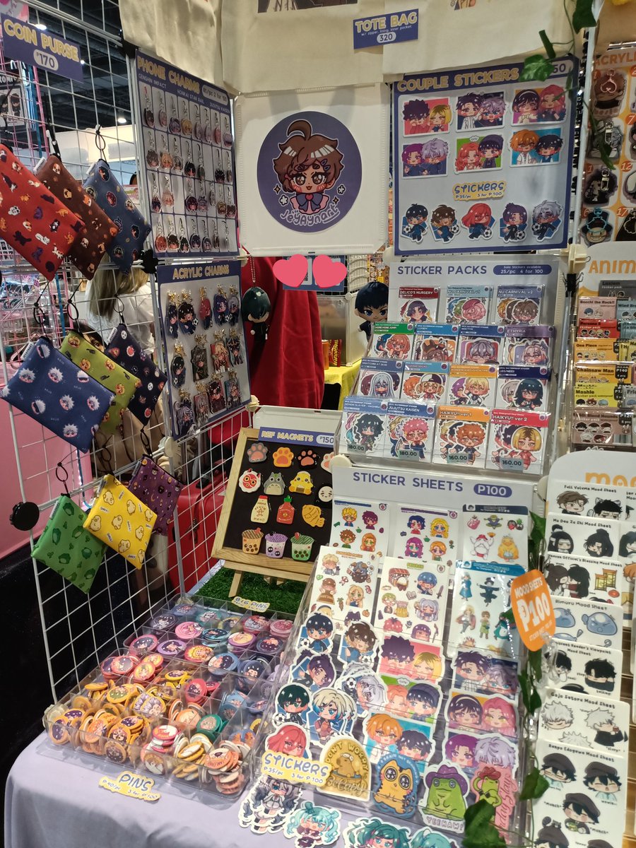 Here's my small booth corner here at cosmania. We're at table FM-01 facing the food stalls &amp; near the exit door that's open.