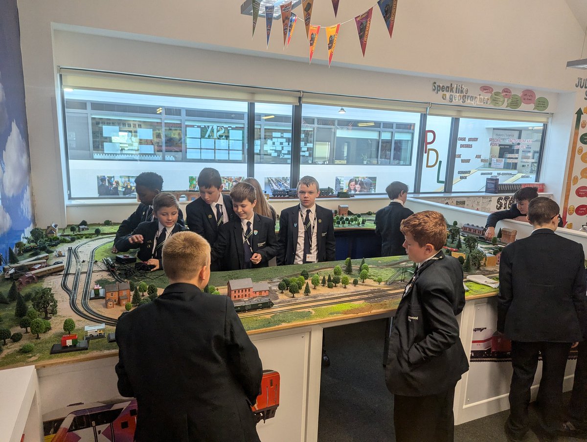 Our model club at lunch time lets you play, create, and build a giant train set and model cars!