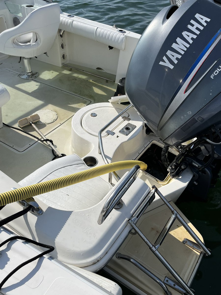 Harbormaster Crew Dewatering a boat heavy with water. 🌊