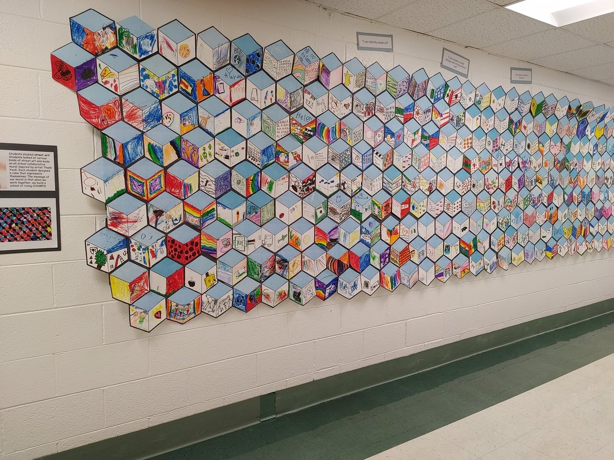 MsRomanArtClass's tweet image. Our mural is finished! Students created a collaborative mural in the style of artist ThankYouX. Each student designed a cube that represents themself. The message of our mural is that when we work together, we build eachother up! @D59Rupley