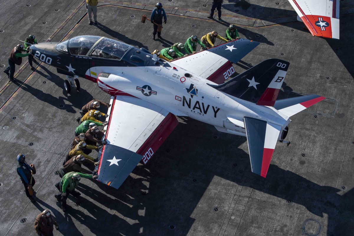 USNavy's tweet photo. Future naval aviators made history aboard @TheCVN69! Students from TW 1 & 2 completed 256 carrier recoveries during CQ training, moving closer to earning their Wings of Gold! 🦅⚓️ Safety, skill & teamwork were key! #WingsOfGold #USNavy #NavalAviation #IKE https://t.co/eyHuHg0wt4