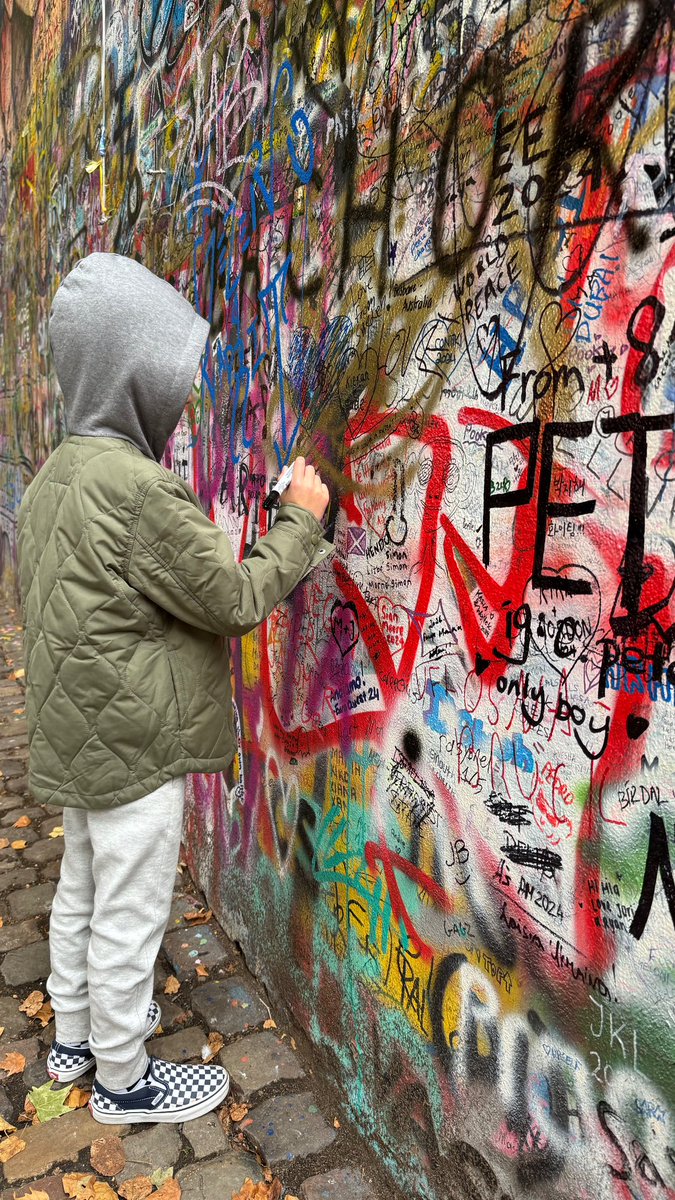 riskybizness's tweet image. Oliver at the Lenin Wall in Prague; 3 hours ‘til puck drop #LetsGoDevils #NJDevils @NJDevils
