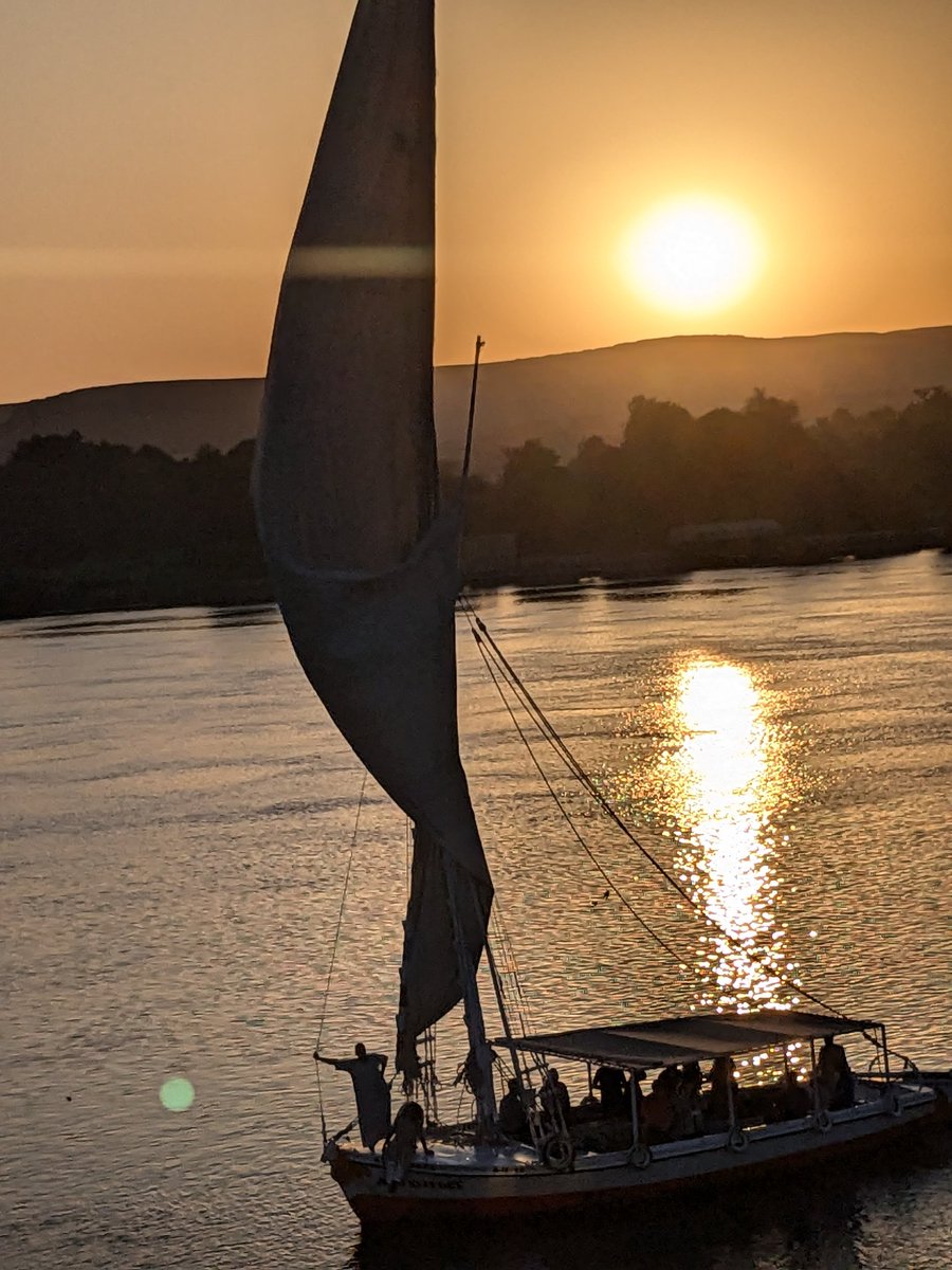 atticafinch's tweet photo. I'm in Egypt. My tour group went on a felucca while I stayed aboard our cruise boat, laid low by a blinding headache. This is them coming home. https://t.co/sK7Rsbqd5q