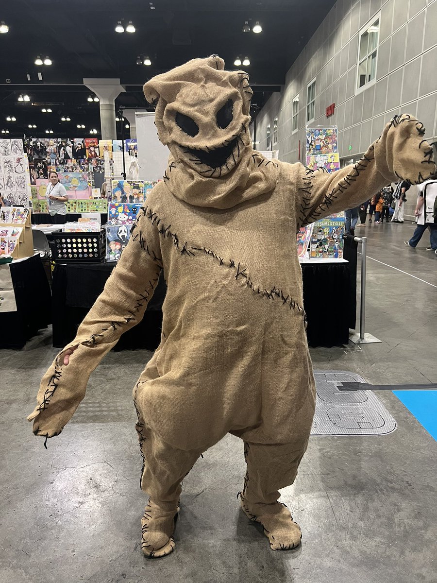 UWildStudios's tweet photo. Oogie Boogie stopped by the booth. This IS Halloween season after all. 

We’re at Table F02 in Artist Alley. 
Friday Only
#lacc #lacc2024 #losangelescomiccon #losangelescomiccon2024 #lacomiccon #lacomicon2024
#comics #artistalley #theworldodtomorrow https://t.co/VHzd1ttdw4