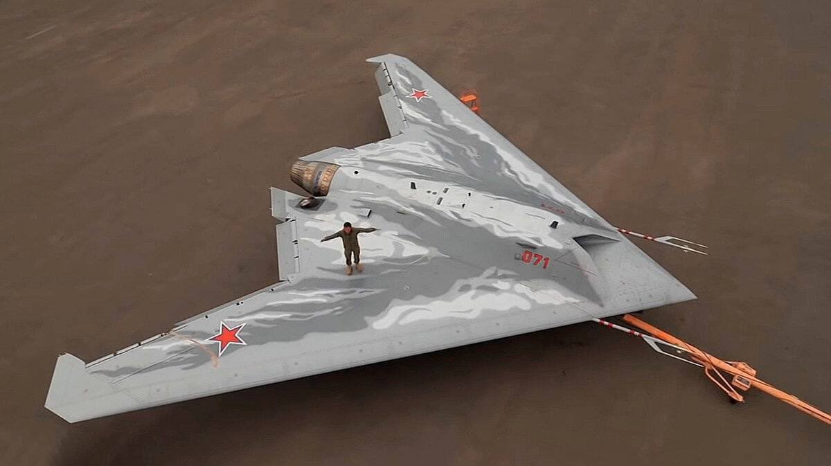 ChrisNaganuma's tweet photo. ⚡️With friends like these, who needs enemies⚡️

Russian “Hunter” Sukhoi S-70 Okhotnik-B UCAV, Russia’s most advanced and experimental UAV was targeted and show down.

The photo I’ve attached shows the star that we witness in the wreckage, also the size is huge in comparison to the human standing on top in the last photo. 

The Sukhoi S-70 Okhotnik-B, also referred to as Hunter-B, is a Russian stealth heavy unmanned combat aerial vehicle being developed by Sukhoi and Russian Aircraft Corporation MiG as a sixth-generation aircraft project, each system costs $15-18 millions and its development cost no less than $170 million.

In the future, it is planned to act under the control of pilots of Su-57 jets, similarly to the USAF Skyborg program. 

Allegedly- The drone lost control with the Su-57 and was heading towards the Ukrainian airspace, probably fear of capture of this aircraft through EW and reverse engineering it caused the high command to destroy it, after the shot we see a sharp turn from the fighter behind the drone.

I’m dropping additional photos of this extremely rare platform in the comments below in the comments. 

I’ve also uploaded additional crash / wreckage footage on the Leaflet telegram - https://t.co/iAjYtQMgmh

#TheLeaflet @ProjectLeaflet