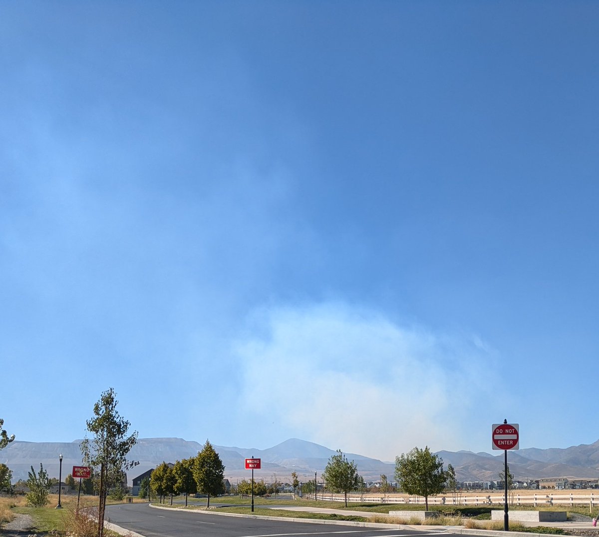 Wildfire on the Oquirrh Mountains. Looks to be in Pass Canyon in Tooele County. Picture taken from South Jordan.