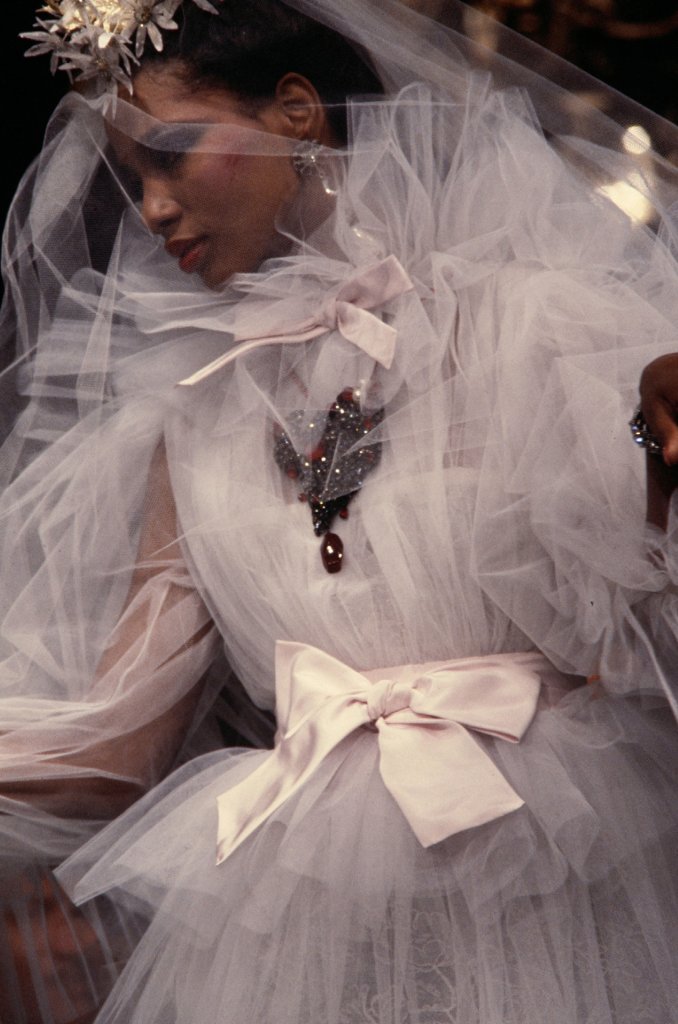 LaurenCDeutsch's tweet photo. #Ootd is this 1983 YSL wedding dress. The exhibit Transparences ended with three wedding dresses, revealing how while the transparent fabrics in wedding wear are often meant to partially obscure the wearer, YSL used his sheer fabrics to make women stand out. All of pieces in the https://t.co/lv2qOZyOGg