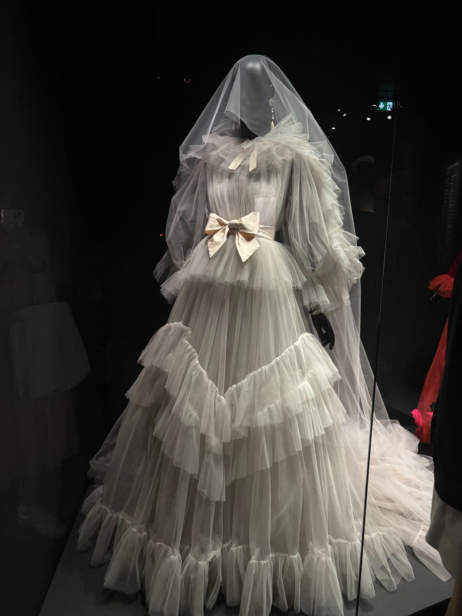 LaurenCDeutsch's tweet photo. #Ootd is this 1983 YSL wedding dress. The exhibit Transparences ended with three wedding dresses, revealing how while the transparent fabrics in wedding wear are often meant to partially obscure the wearer, YSL used his sheer fabrics to make women stand out. All of pieces in the https://t.co/lv2qOZyOGg