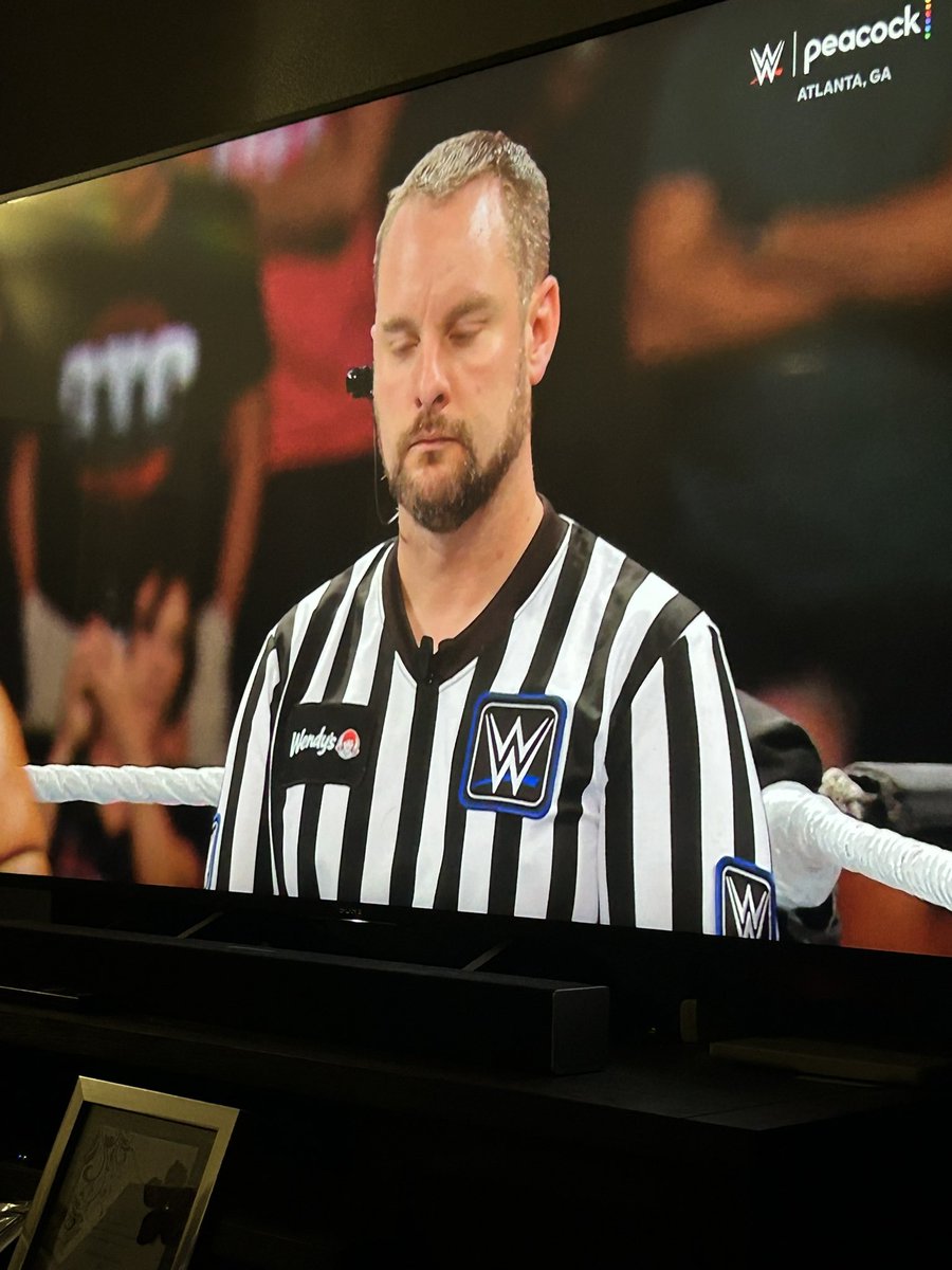DiceDoPart's tweet image. Not my normal content but why does this WWE ref have Wendy’s on his shirt?!