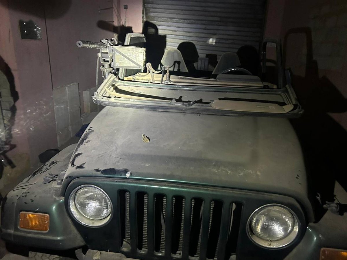 Megatron_ron's tweet photo. Israel claims to have captured several Hezbollah strongholds and tunnels in southern Lebanon, loaded with weapons.  

They showed an Israeli-made machine gun and a jeep, which strangely has an inscription in Hebrew that they forgot to remove.  

Which suggests it's another propaganda video filmed somewhere in Israel.