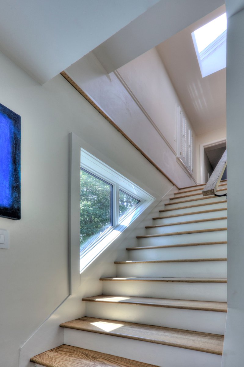 For a small house renovation, our sustainable design explored triangular units in smaller stair spaces, floor to ceiling windows, &amp; open floor space. #greendesign #greenbuilding #netzero #buildbetter #architecture #sustainablearchitecture #trilliumarchitects #greenarchitect