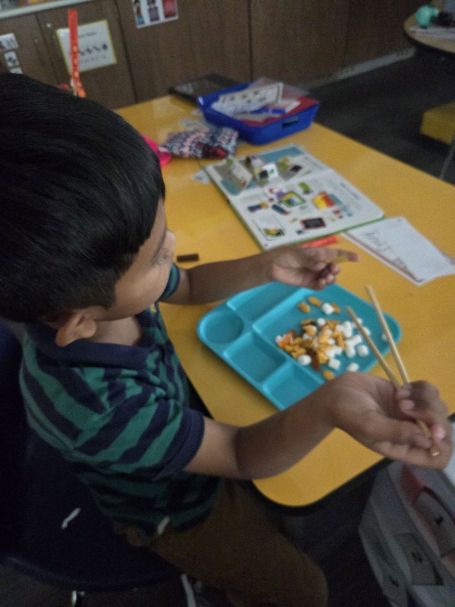 PREPRIDE's tweet image. Students have been studying where animals live and what they eat. They participated in a read-aloud of Birds by Kevin Henke. Then, they used chop sticks to pick up various foods like birds!