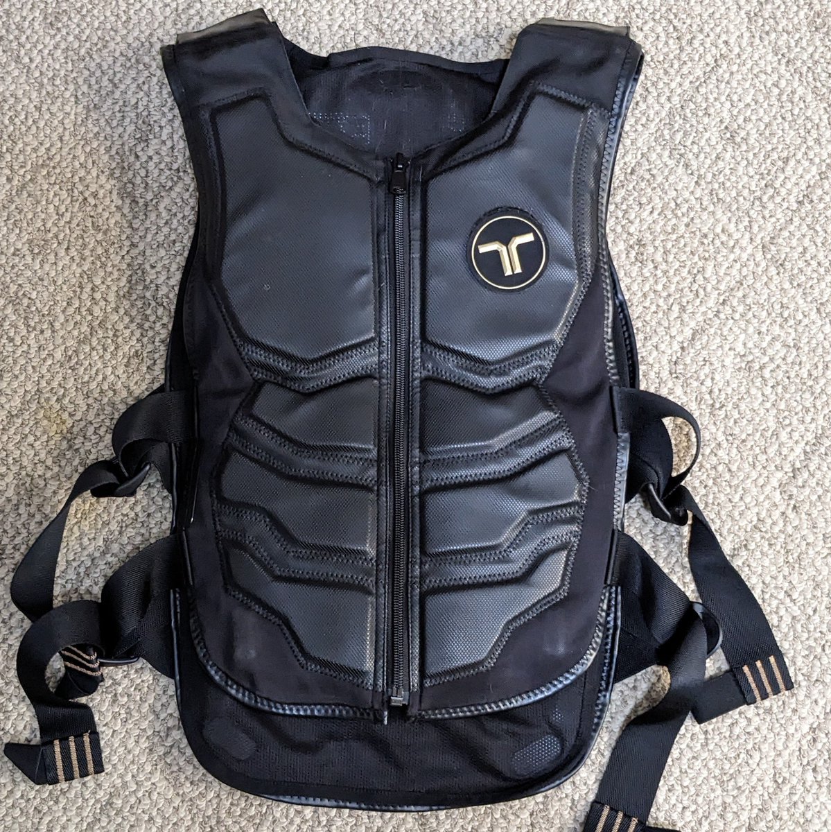 CyberWilhelm's tweet photo. I've been curious about haptic vests for ages, but couldn't justify one. Found a used bHaptics Tactsuit X40 locally for $175 and pounced. 

No illusions about casual practicality, but pretty fun so far! Developing thoughts on what makes good integrations.

Excited to code for it! https://t.co/cjlHp912QG