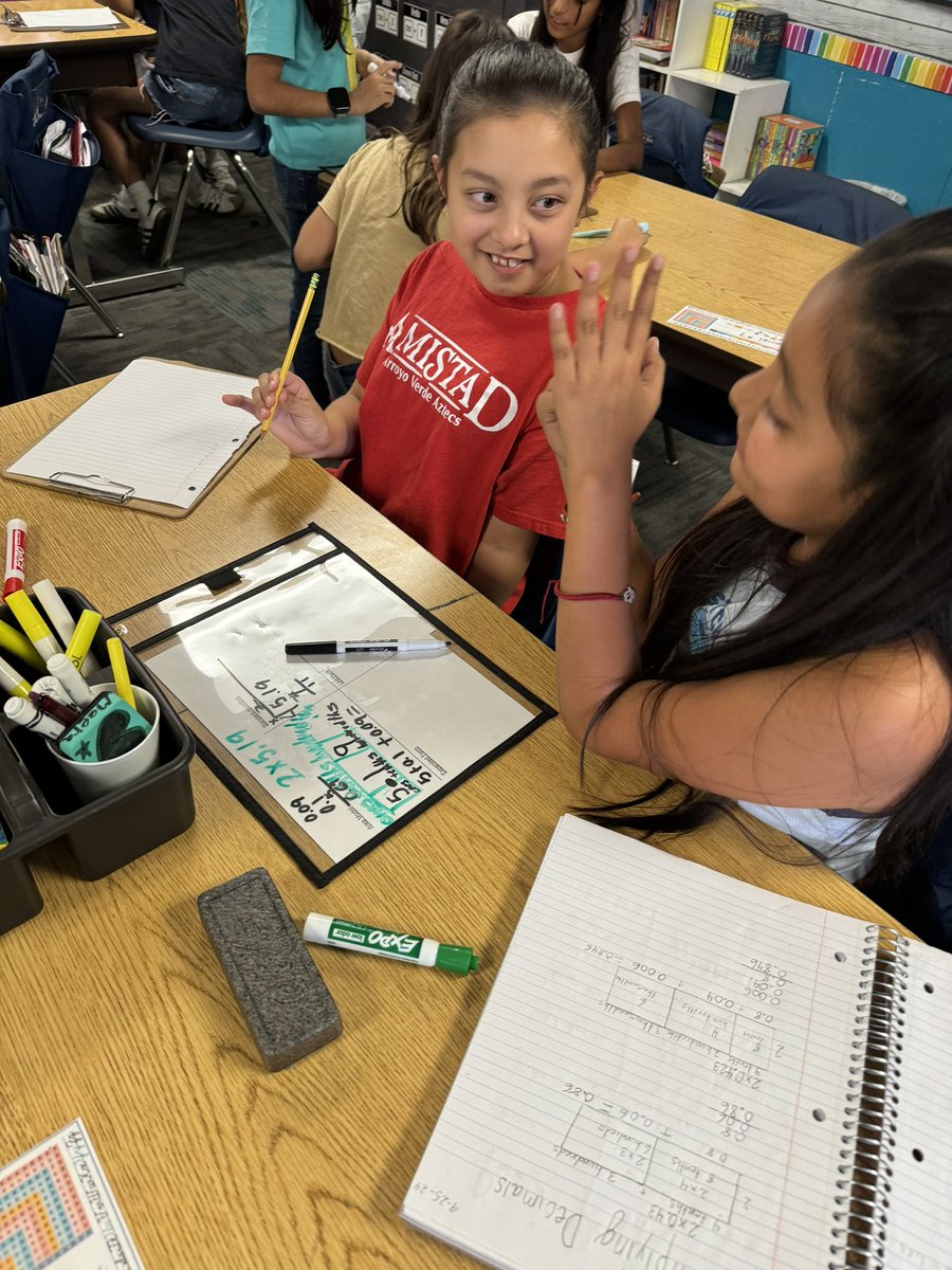 ArroyoVerdeRUSD's tweet photo. Students in Ms. Henderson’s class working collaboratively on the end of unit review in fifth grade mathematics. #thisisrusd #mathskills #mathintheclassroom #arroyorusd https://t.co/GPseZwS5HF