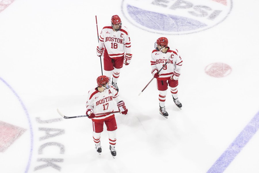 Quinn Hutson, Shane Lachance and Ryan Greene look at each other before a faceoff