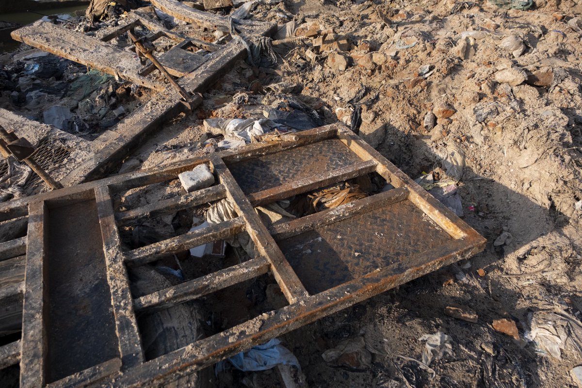 “When the flood came, it reached our house and later I discovered my shop was also flooded. I sell leather. The building behind me was my shop. Currently we are still living in the destroyed buildings. We want to try to repair the house and the shop as well. I am currently taking