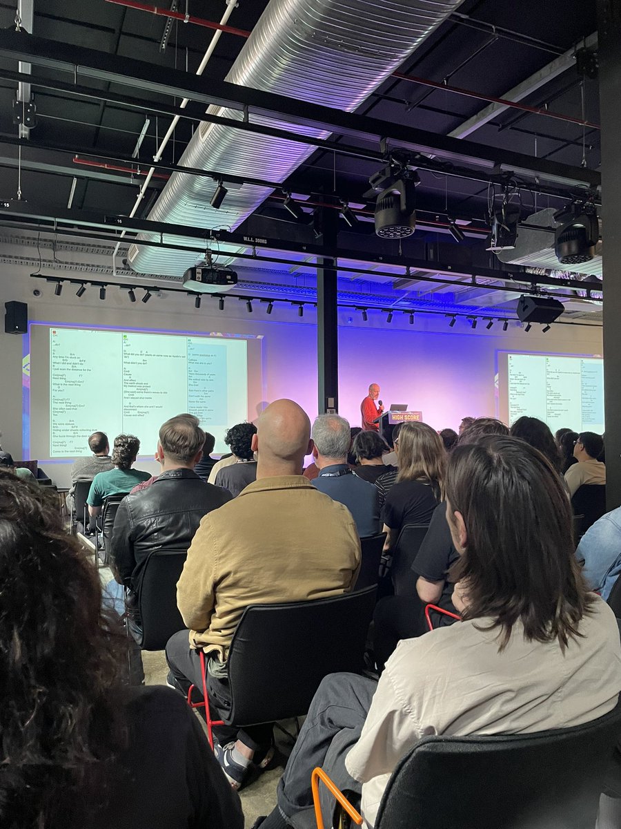 SymmetriaSound's tweet photo. “It’s really hard to explain to a friend.” Fantastic closing keynote from @SimonYonHall &amp; @actualmontaigne getting into the business of songwriting for Stray Gods @summerfallgames ❤️‍🔥 Be willing &amp; enthusiastic to dive in &amp; invent #onlyifonly #highscore24 https://t.co/tvAJDJYrd0