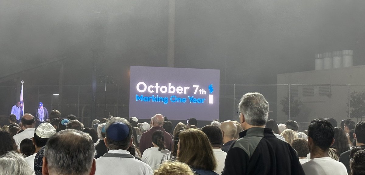 ChiefZimmerman's tweet photo. Standing with thousands shoulder to shoulder ⁦@lfjcc⁩ honoring the memory of those savagely murdered in Israel one year ago by Hamas terrorists. We pay tribute to the resilience of the Jewish people and pray for the safe return of the hostages. #October7th #BringThemHome https://t.co/wjMbc2lQWl