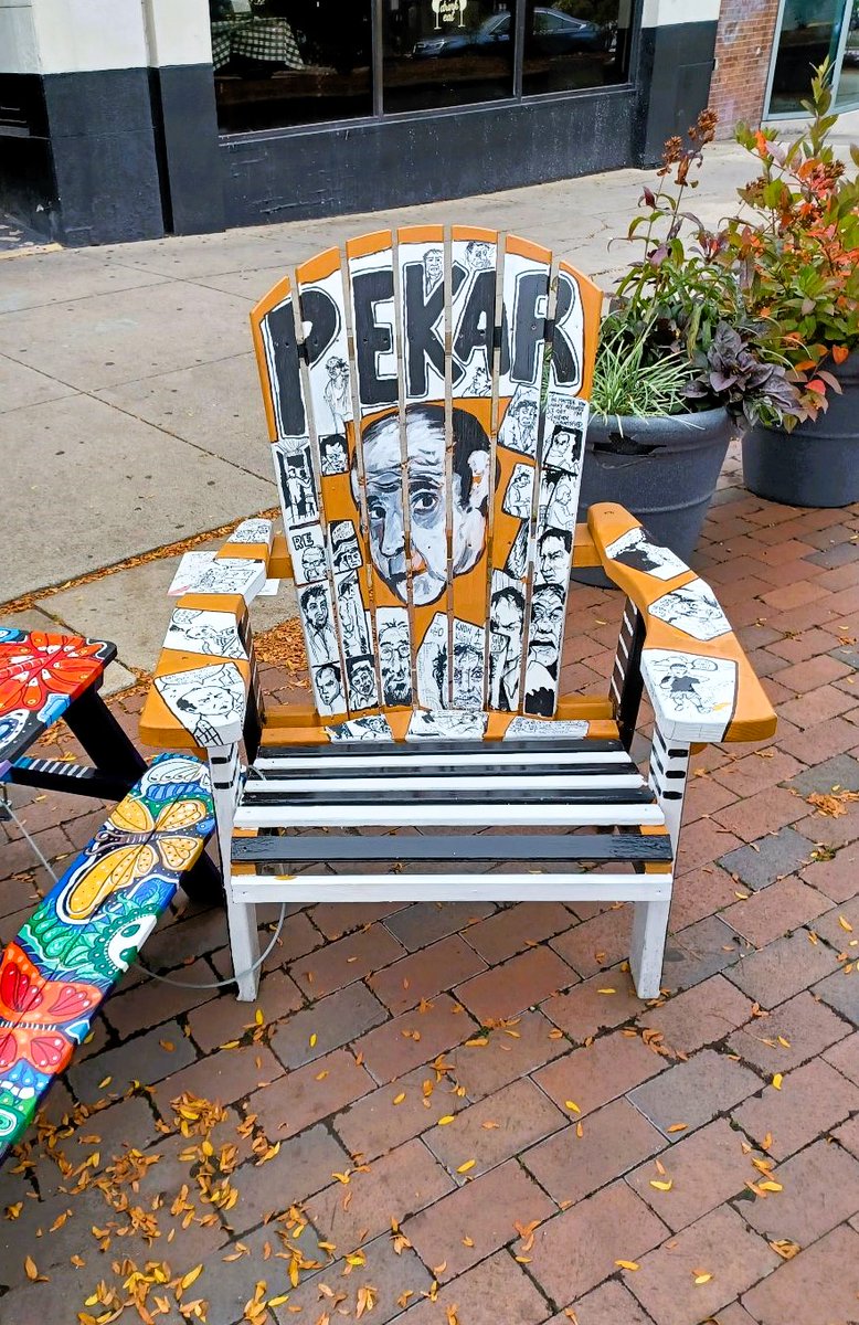 PlasticGrapes99's tweet photo. Happy Eternal Birthday Harvey Pekar! Spotted this chair while in Coventry last week for the Mac's Backs event! Kind of wonderful in every way! https://t.co/YZ7L5ITRn6