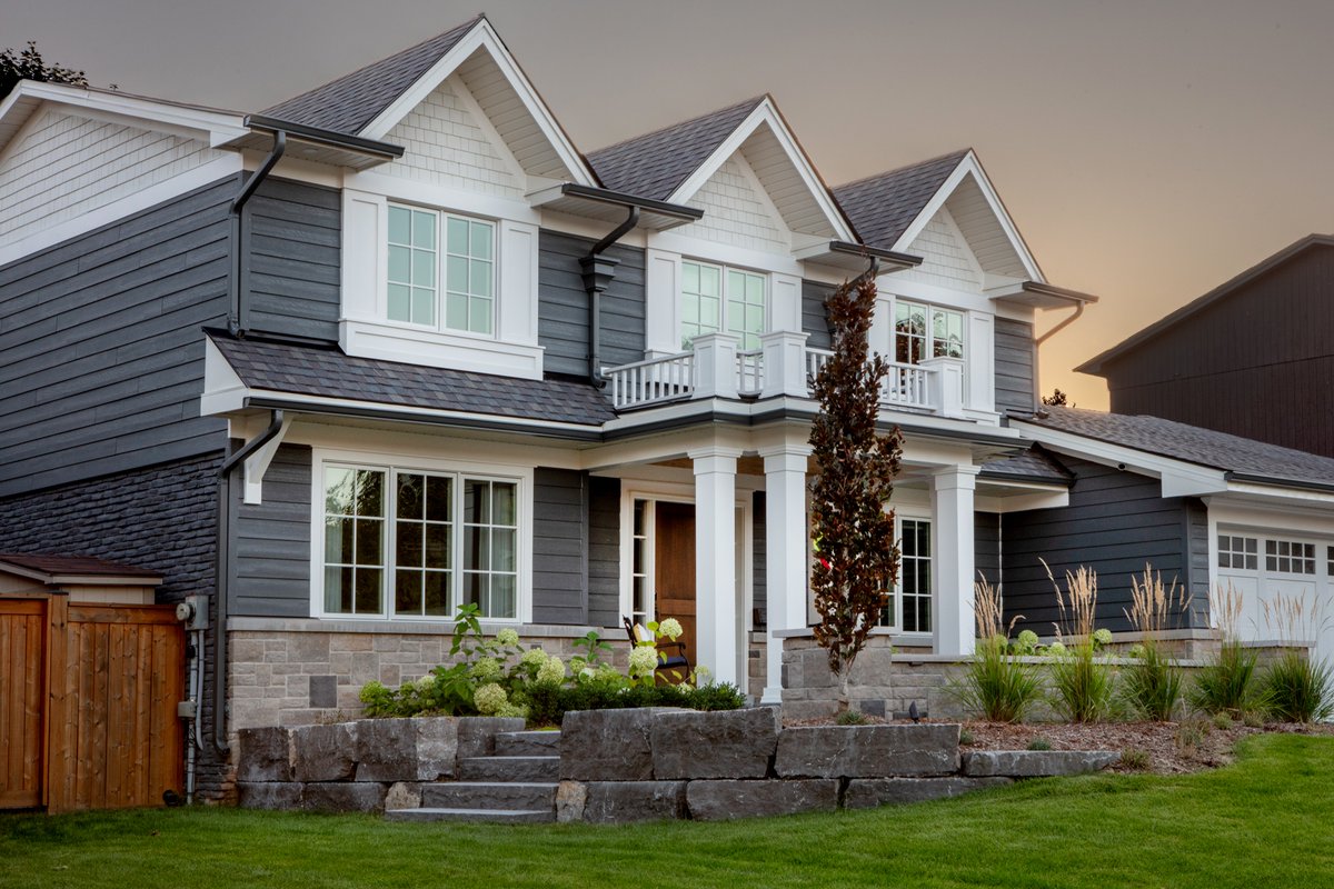 Originally a 70’s colonial revival, Green Meadow's facade lacked depth and character. Our extensive exterior renovation began with a foundation addition to support a stunning new covered porch and Juliette balcony, enhancing the home’s visual appeal.