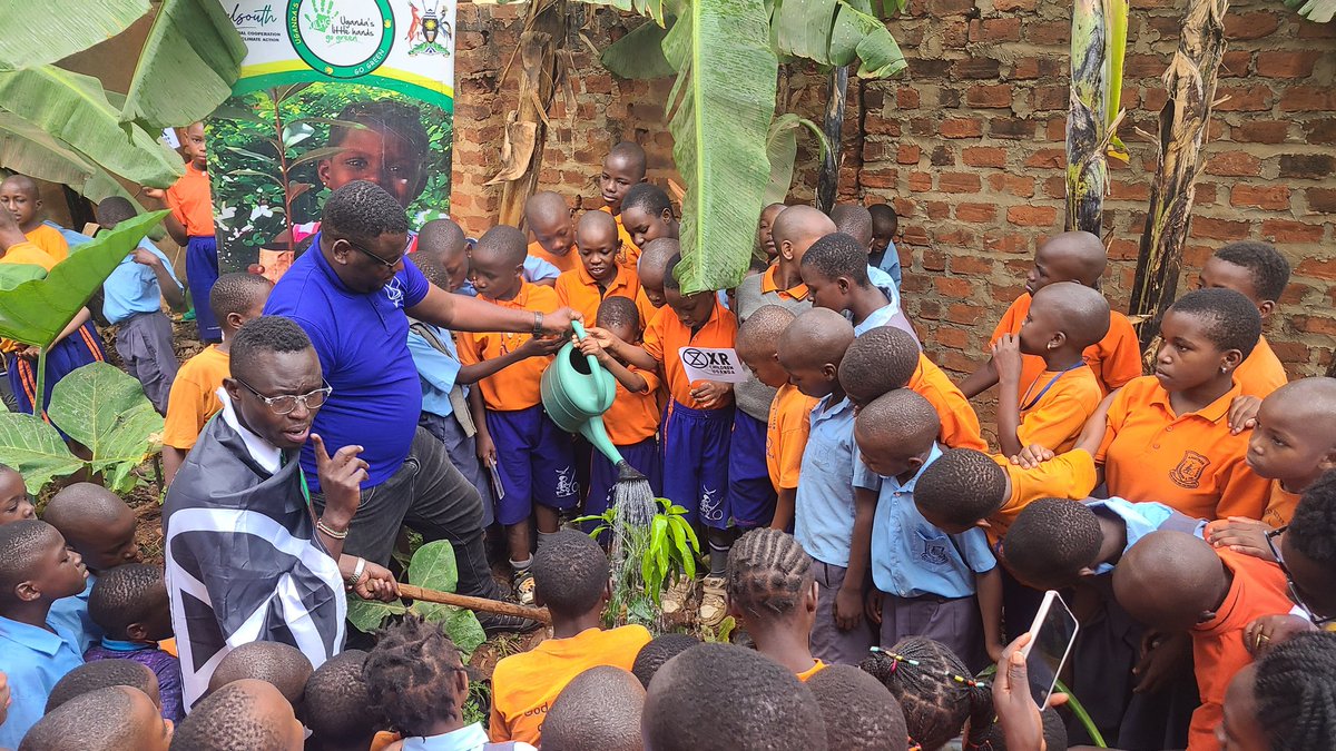 XRChildren's tweet photo. In our efforts to cultivate the next generation of eco-rebels, @LilHandsGoGreen joined us to plant fruit trees at Abesther Primary School. #ExtinctionRebellion #GoGreenUg 

@XRLondon @xruganda @XRIslington @JosephMasembe1 https://t.co/OYew7A2xLB
