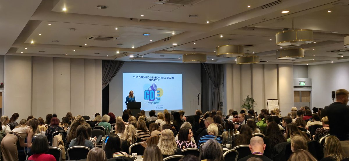pdLouiseP's tweet photo. .@klparadine addressing a packed room to kick off #GOE24. Mentioning partnership with @OUPPrimary for #TalkForMaths Benchmarks, #StoriesForMaths #NumiconEssentials. @kathleenvoice21 and I will talk about this at 10 am in the Rookeries (near entrance!) https://t.co/XSAHMeowLd