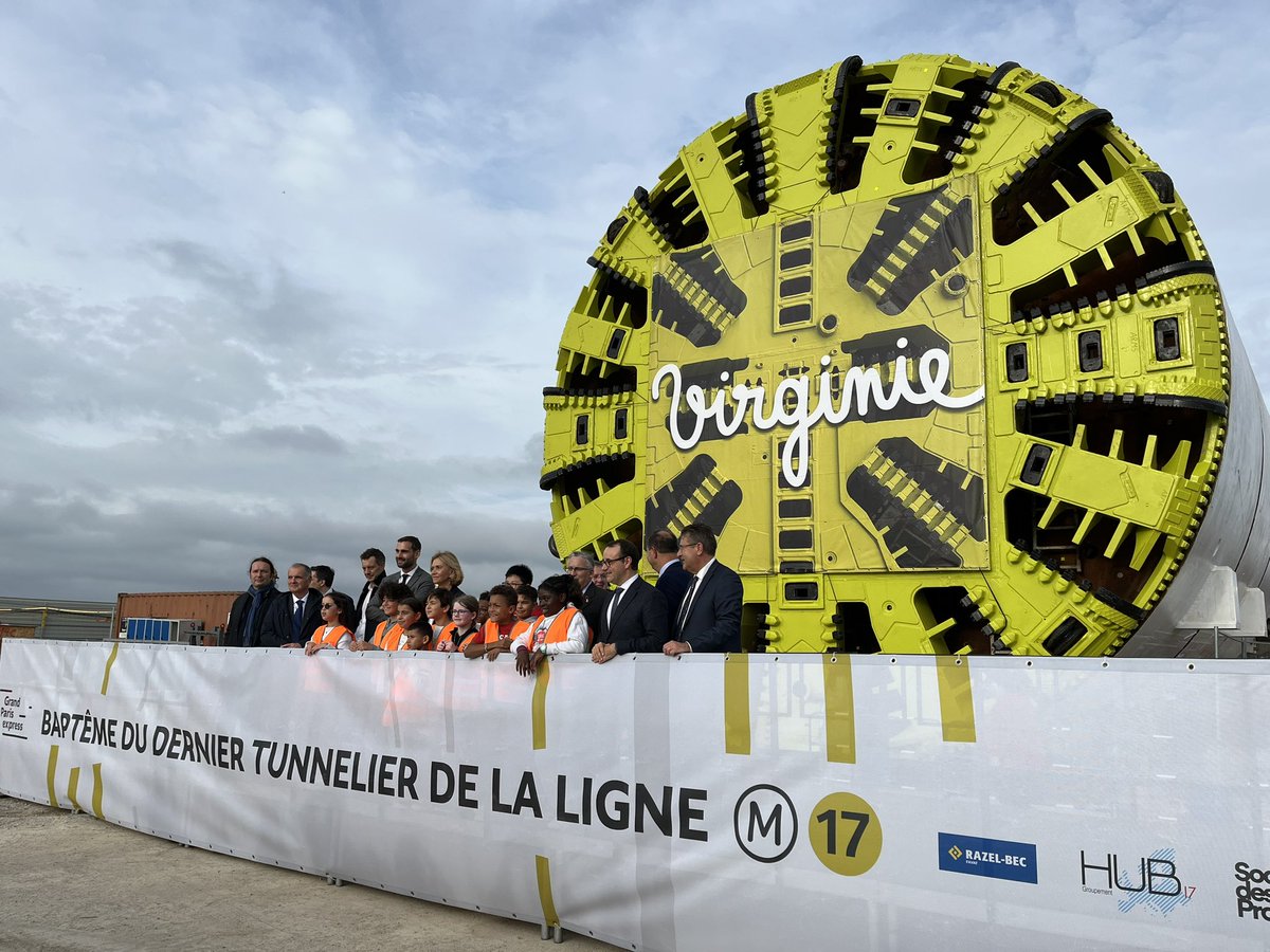 31e baptême de tunnelier pour le <a href="/GdParisExpress/">Grand Paris Express</a> au moment d’engager le creusement du dernier tronçon de la ligne 17.

Virginie Guyot, première femme à avoir commandé la Patrouille de France, a été désignée marraine par les élèves de l’école Saint-Exupéry du Mesnil-Amelot.