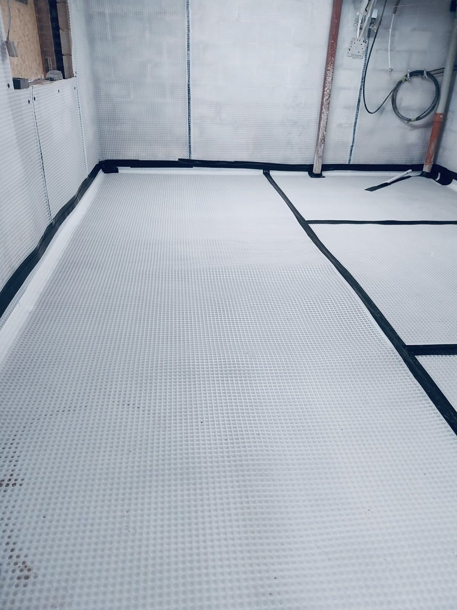 A neat Cavity Drain installation in this Cheltenham lower ground floor. Wall and floor membrane with drainage channels create a dry habitable space to house a cinema room. #waterproofing #basement #lowergroundfloor #cinemaroom #cheltenham #gloucestershire