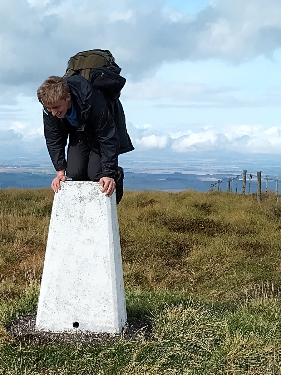 Guy "triangulating" himself on the Curr's trigpoint in last weeks sunshine! (We had a short trip into Scotland along the Pennine way, following the Hethpool to the Curr promoted route on NNP website. #nationaltrails #pennineway #trigpoint