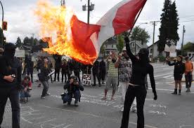 Flag burning is LEGAL in Canada.    I say we avoid the rush to condemn and be outraged.  The freedom to burn the flag is an essential component of freedom of speech.  Burning the flag is are not stating that the people of the nation should die.  It refers to the STATE